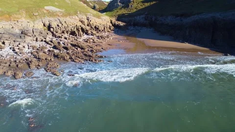 Fast Approach to Beach at High Tide with Small Patch of Sand as Waves Roll In. Stock Footage 322512445