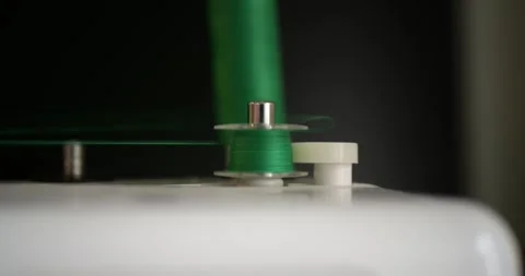 Fast Automatic Thread Winding Bobbin Electric Motor Machine Ejecting Full Spool Stock Footage 321809736
