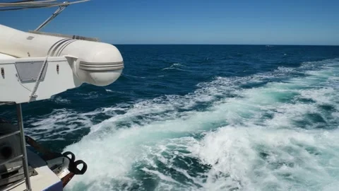Fast Boat Engine Wake Foam and Inflatable Tender Zodiac Close Up Stock Footage 346790267