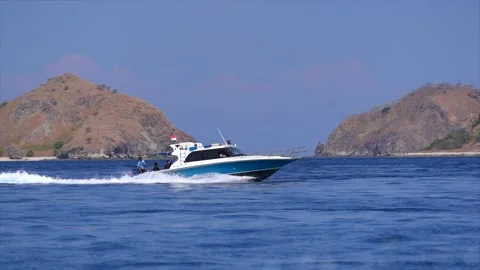 Fast boat sailing through the tropical waters of Komodo Island, Indonesia. Stock Footage 341269570