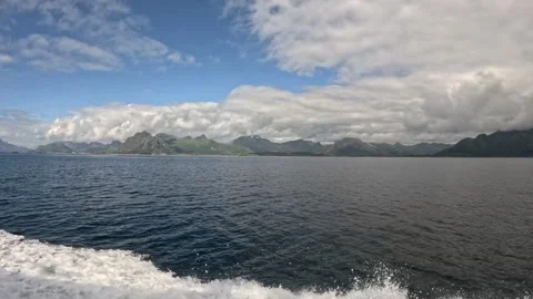 Fast boat wake with sea spray on open fjord Lofoten 動画素材 344047604