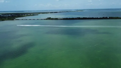 Fast boats coming into Big Pine Key Fl drone shot two Stock Footage 343963832