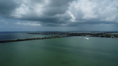 Fast boats coming into Big Pine Key Fl drone shot Stock Footage 343964094