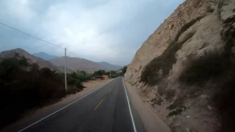 Fast camera of a bus trip on the road to Huaras with mountains and blue sky 库存影片 164436806