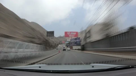 Fast camera driving down Raul Ferrero avenue, lima, peru Video stock 141947128