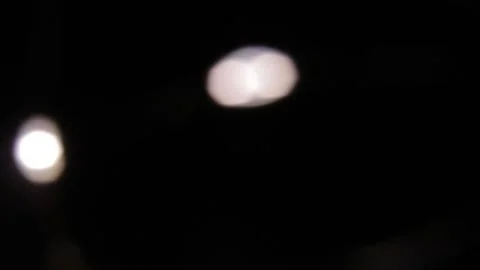 Fast camera movement on distant lights facing right in the darkness 스톡 동영상 317484800