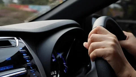 Fast car driving speed, close-up woman hand control steering wheel Video stock 90383066