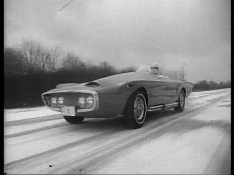Fast car on test course late 1950s or early 1960s Stock Footage 81909454