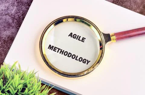 Fast changes concept. AGILE METHODOLOGY in a notebook on a purple background  写真素材