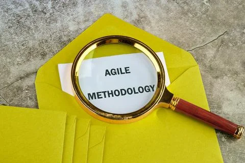 Fast changes concept. AGILE METHODOLOGY on paper sticking out of a mustard-co Foto stock