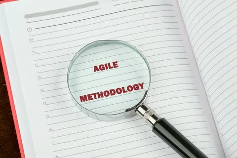 Fast changes concept. AGILE METHODOLOGY on a blank page of a business noteboo Stock Photos