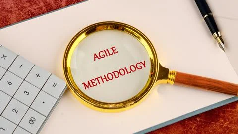 Fast changes concept. AGILE METHODOLOGY written in a business book, top view  Stock Photos