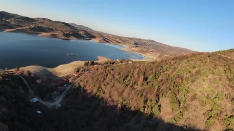 Fast Cinematic FPV Drone Flight Along Hills and Trees Near Tikvesh Lake. Video stock 330610858