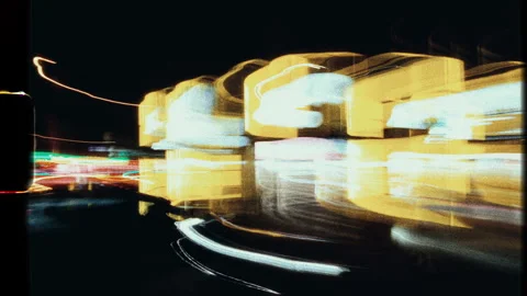 Fast city lights streaking across frame in super 8 film style Stock Footage 303765584