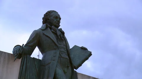 Fast clouds behind statue of Francisco de Goya in his home town Stock Footage 39253373