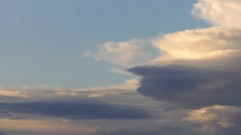 Fast clouds in morning light - 4K time-lapse Stock Footage 106189291