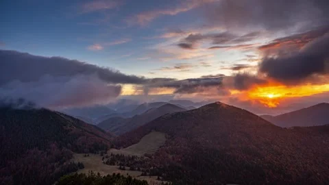 Fast clouds moving in autumn forest mountains at golden sunrise Time lapse Stock Footage 292928251