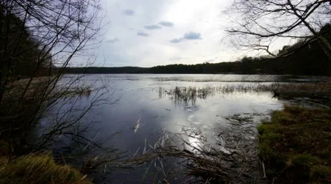 Fast clouds over the lake at a stormy day Stock Footage 47210380