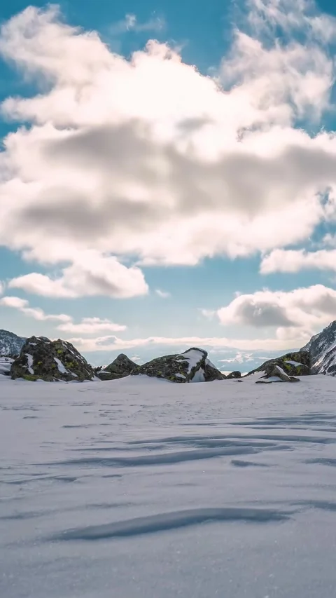 Fast Clouds Over Snowy Mountains in Sunny Winter, Vertical Time Lapse Stock Footage 313210473