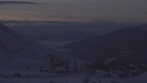 Fast clouds in winter mountains at sunrise time-lapse Stock Footage 103305419