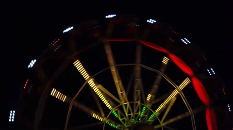 Fast colored carousel at night Stock Footage 68760191