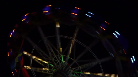 Fast colored carousel at night Stock Footage 68760286