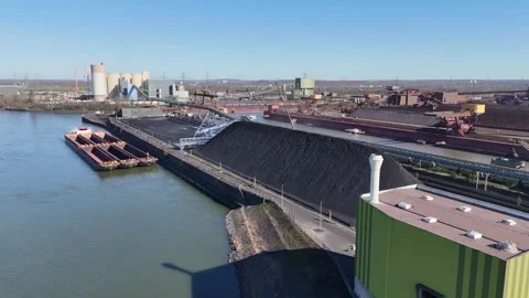 Fast curved pass around tower and coal mound Stock Footage 331205882