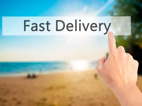 Fast Delivery - Hand pressing a button on blurred background concept on visua Stock Photos