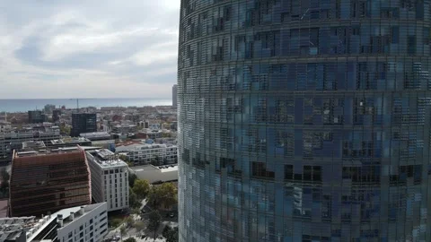 Fast descending orbit around reflective city tower Stock Footage 331847324