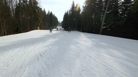 Fast descent down the ski slope on skis. POV Video stock 219012134