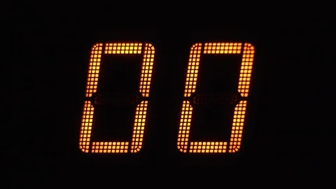Fast digital countdown in orange numbers on an electronic display from 0 to 99 Stock Footage 122138103