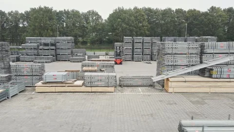 Fast dolly of construction materials stacked up on an industrial storage yard Stock Footage 318725408