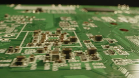 Fast dolly of a printed circuit board in a dark studio Stock Footage 315631063