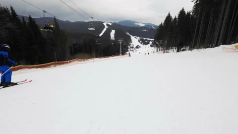 Fast downhill skiing on the ski slope. First-person view. POV Stock Footage 219014065