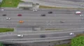 Fast-driving car traffic on city highway, view from above HD Footage