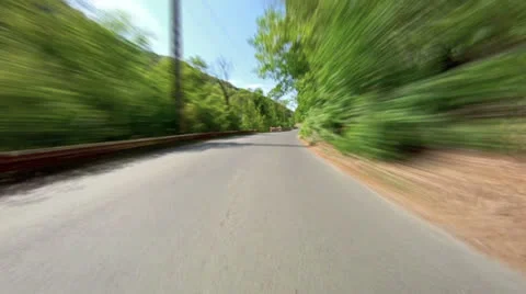Fast driving on the road in a forest. Stock Footage 24746646