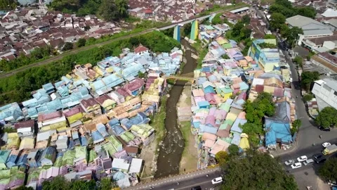 Fast Drone Approach with Tilt Down Over Colorful Village, Malang, Indonesia Stock Footage 315190991