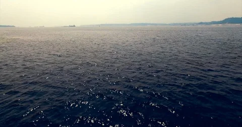 Fast drone flight close to the water surface over the border of rivers 스톡 동영상 121783708