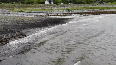 Fast drone flight over the sea and a black beach Stock Footage 114748812