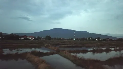 Fast Drone Flyover of Chiang Mai City with Rice Paddy Fields and Urban Skyline Stock-Footage 333698962
