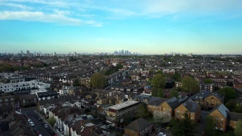 Fast drone shot flying backwards over South London residential suburb 動画素材 183450148
