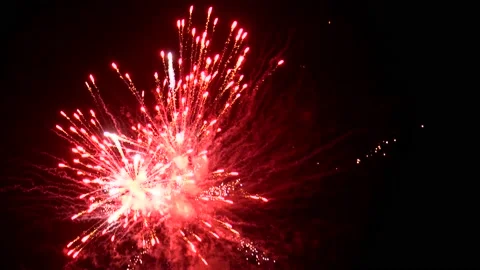 Fast explosions of light and color from dramatic fireworks display during Stock Footage 153988724