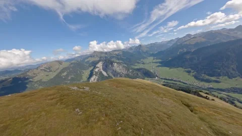 Fast extreme close diving drop down fly steep rocky mountain rock peak slopes Stock Footage 163508244