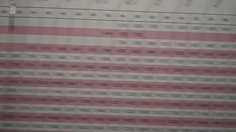 Fast eye-tracking macro scan across 1995 German DB ICE train timetable foldou Stock Footage 345506489