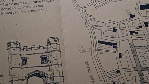 Fast eye-tracking macro scan across 1995 Kings Lynn illustrated town guide .. Stock Footage 345506739
