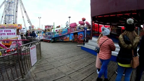 Fast fairground ride on pier Stock Footage