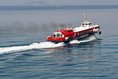 Fast ferry accelerating with thick black smoke from funnels Stock Photos