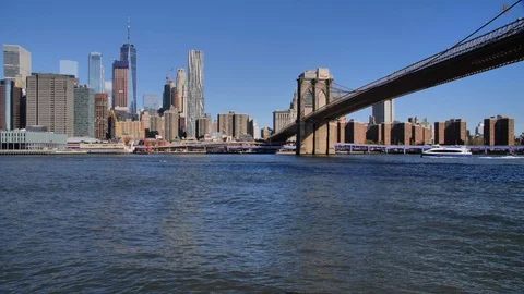 Fast Ferry passing under the Brooklyn Bridge, New York City Stock Footage 116685824