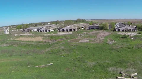 Fast flight to  destroyed  rural cowsheds. Aerial view Видео 39211166