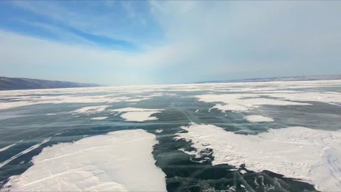 Fast flight on an FPV drone over the frozen Lake Baikal 動画素材 170761506